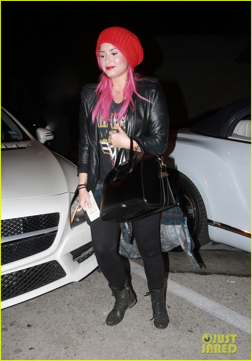 Demi Lovato shows off her pink hair as she enters Craig's restaurant to meet Selena Gomez for dinner in Los Angeles