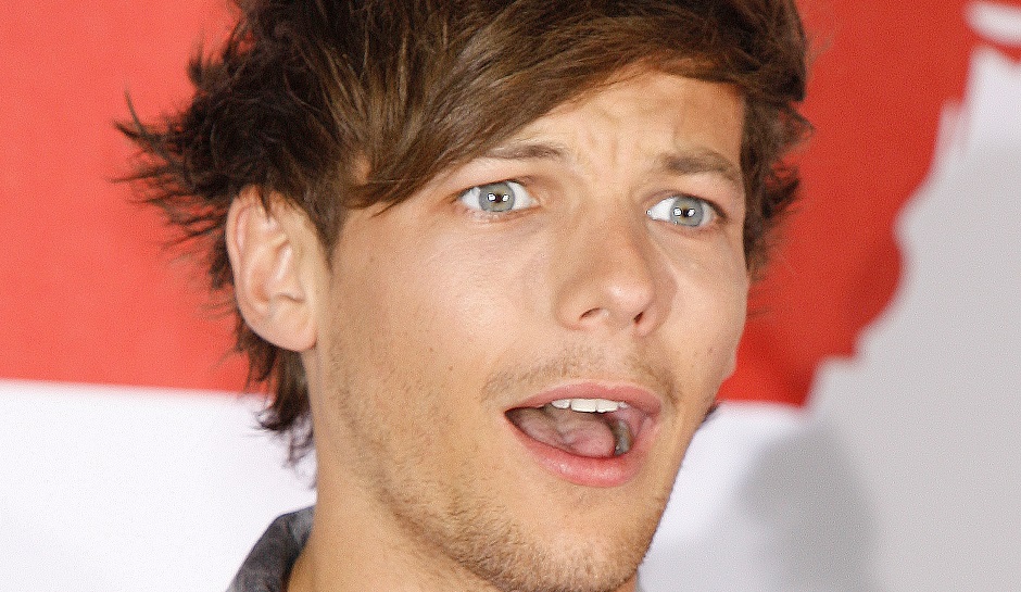 Louis Tomlinson attends the launch of the One Direction film "This is us 3D" at Big Sky Studios in London on Monday, August 19, 2013. (Photo by Jon Furniss Photography/Invision/AP)