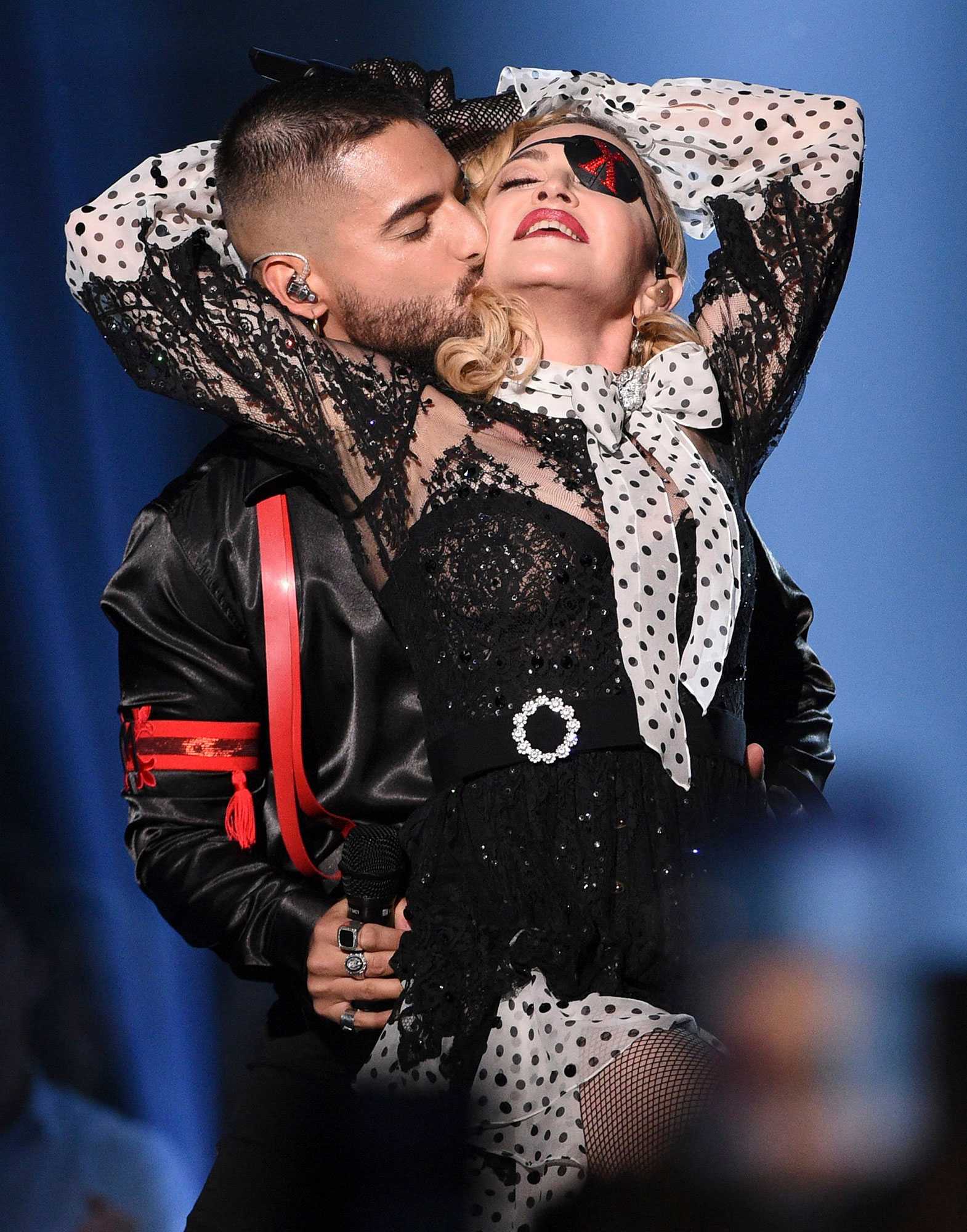 Mandatory Credit: Photo by Chris Pizzello/Invision/AP/REX/Shutterstock (10225918bc) Maluma,Madonna. Maluma, left, kisses Madonna as they perform "Medellin" at the Billboard Music Awards, at the MGM Grand Garden Arena in Las Vegas 2019 Billboard Music Awards - Show, Las Vegas, USA - 01 May 2019